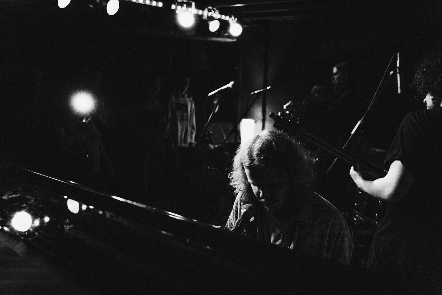 Black and white photograph of Thomas Ashby playing a grand piano.